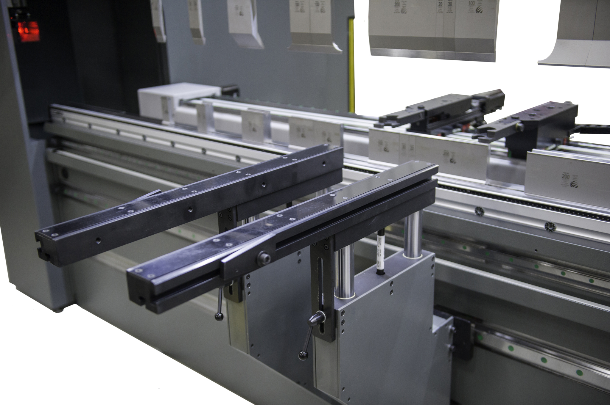 CNC press brake bending heavy steel plate in a metal fabrication shop